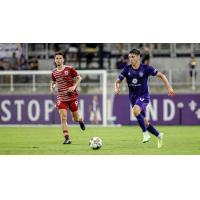 Louisville City FC defender Wes Charpie (right)
