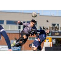 Danny Griffin of the Pittsburgh Riverhounds heads the ball