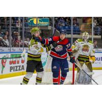 Saginaw Spirit's James Guo and North Bay Battalion's Ethan Procyszyn and Dom DiVincentiis on game night