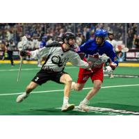 Colorado Mammoth defender Tim Edwards (left) vs. the Toronto Rock