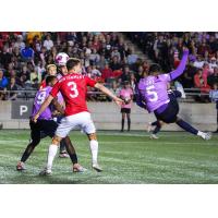 Atlético Ottawa defender Luke Singh scoring an acrobatic effort against Cavalry FC at TD Place