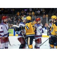Kitchener Rangers' Jackson Parsons congratulated by Erie Otters' Owain Johnston