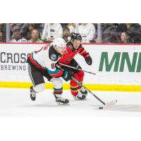 Kelowna Rockets' Marek Rocak versus Prince George Cougars ' Riley Heidt
