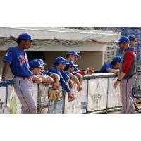 Green Bay Rockers listen in the dugout