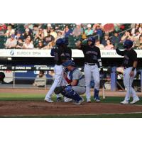 Syracuse Mets' Pablo Reyes congratulated by teammates