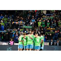 Sounders FC huddle in front of their fans