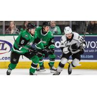 Texas Stars' Gavin White and Antonio Stranges and Ontario Reign's Samuel Fagemo in action