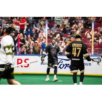 Rochester Knighthawks' Ian Llord and Vancouver Warriors' Keegan Bal and Dhylan McIntosh on game night
