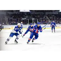 Syracuse Crunch center Dylan Duke (left) vs. the Rochester Americans