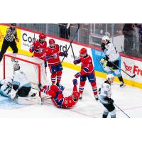 Assanali Sarkenov of the Spokane Chiefs reacts from the ice following his goal