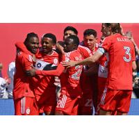 Chicago Fire FC exchanges congratulations after a goal against Atlanta United FC