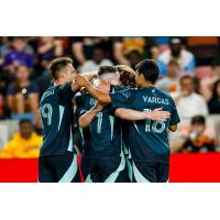 Seattle Sounders FC's Danny Musovski, Ryan Kent, and Obed Vargas celebrate win