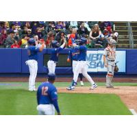 Joey Meneses of the Syracuse Mets crosses home plate