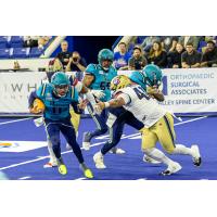 Massachusetts Pirates quarterback Kenji Bahar on the run