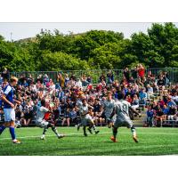 Ben Marsh (centre) celebrates scoring for Wanderers U21
