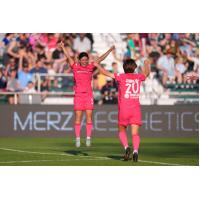 North Carolina Courage forward Manaka Matsukubo (left) celebrates her brace