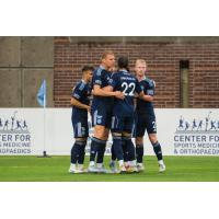 Chattanooga FC gathers after Peter Plougmand's goal