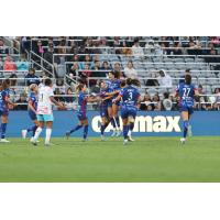 Ryan Williams (center) and the North Carolina Courage gather after their first goal