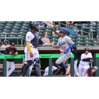 Yeiner Fernandez scores a run for the Tulsa Drillers