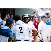Isiah Gilliam is greeted by Kansas City Monarchs teammate Jaylyn Williams (#2)
