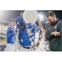 Biloxi Shuckers douse Zavier Warren after the game