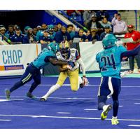 Massachusetts Pirates make a tackle vs. the Quad City Steamwheelers