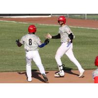 Abdiel Layer (right) of the Sioux City Explorers gets congratulated
