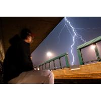 Fargo-Moorhead RedHawks watch the lightning from the dugout