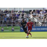 Evan Conway of North Carolina FC advances the ball