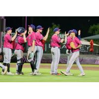 Pensacola Blue Wahoos exchange high fives following a victory