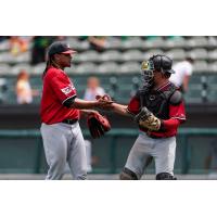 Felix Cepeda and Kurtis Byrne celebrate for the Sioux City Explorers
