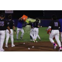 Syracuse Mets celebrate a Yonny Hernandez walk-off hit