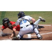 Biloxi Shuckers catcher Darrien Miller applies the tag