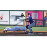 Tulsa Drillers first basemen John Rhodes fields a throw