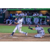 Tri-City Dust Devils first baseman Matt Coutney makes contact