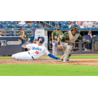 Kyle Nevin of the Tulsa Drillers slides slides safely to score