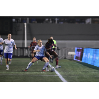 Ottawa Rapid FC contests a ball along the sideline vs. AFC Toronto