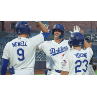 Kyle Nevin of the Tulsa Drillers receives high fives