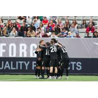Atlético Ottawa huddle at Forge FC