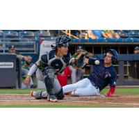 San Antonio Missions' Eli Wilson and Tulsa Drillers' Chris Newell in action