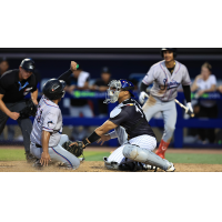 St. Lucie Mets catcher Daiverson Gutierrez applies the tag against the Jupiter Hammerheads