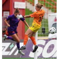 Kathryn Harvey of Calgary Wild FC gets a ball past Halifax Tides FC