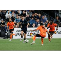 Colorado Springs Switchbacks FC's Quenzi Huerman versus Orange County SC's Kevin Partida