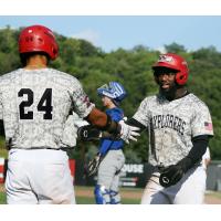 D'Shawn Knowles of the Sioux City Explorers is congratulated by #24 Torin Montgomery