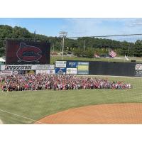 Fans gather on the field after the final Carolina Mudcats home game