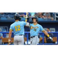 Montgomery Biscuits catcher Tatem Levins (left) congratulates outfielder Colton Ledbetter