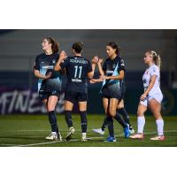 NJ/NY Gotham FC exchange congratulations after a goal in Concacaf W Champions Cup Group Stage play