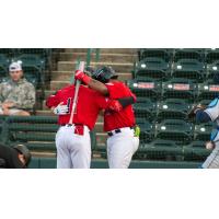Hickory Crawdads celebrate after scoring