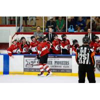 Vancouver Giants right wing Tyus Sparks receives congratulations from the bench