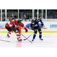 Vancouver Giants forward Richard Wonyeneh (left)